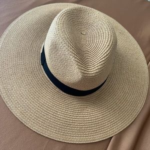 Straw hat with black details.